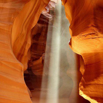 light pours through the red rocks of Antelope Canyon