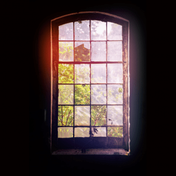 Sun shining through and old paned window