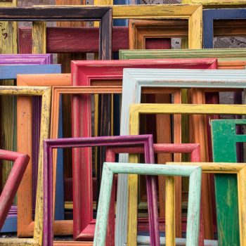 a collection of colorful, empty picture frames