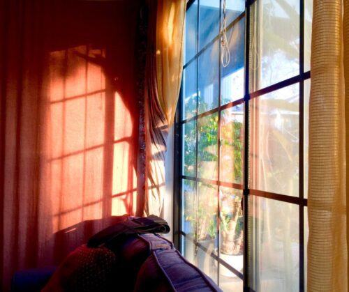 Light shining through a large window.