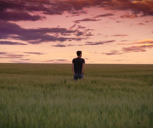 A man standing in an open field