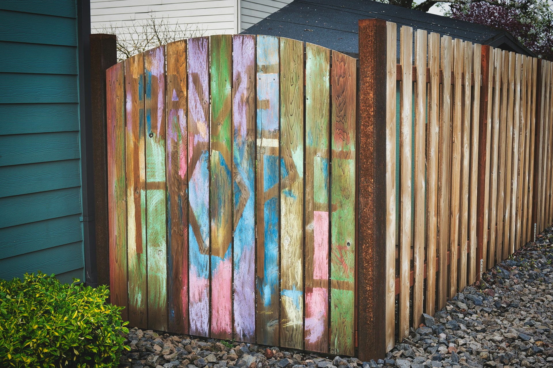 Wooden fence gate with the words "Have Hope" painted on